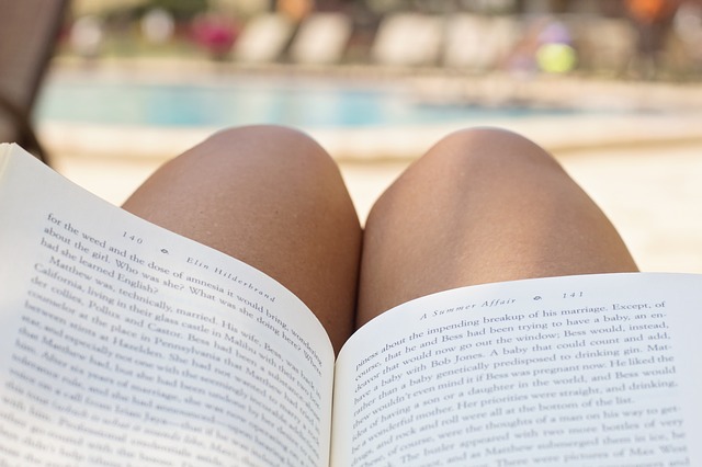 reading book poolside
